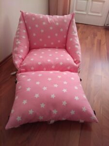 Folding floor armchair with cushion.